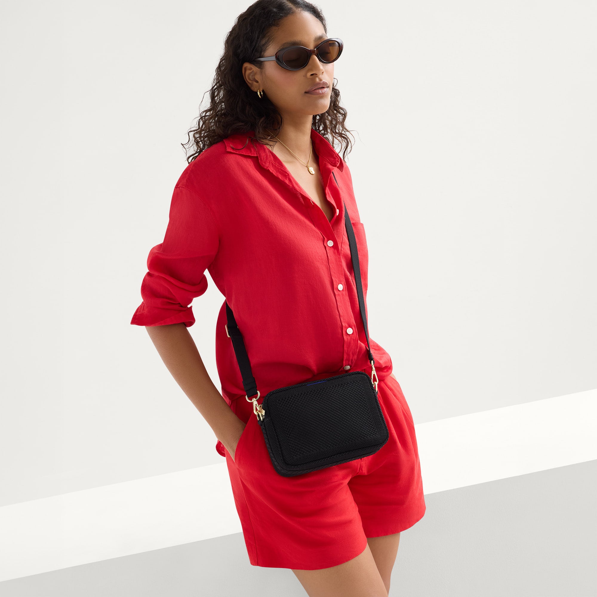 450_Crossbody_Camera_Bag_Braided_Black_Licorice_Open-Kni_On_Figure_v24479.jpg
